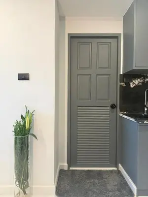 a grey door in a kitchen with a vase at Peaceful Cozy Apt with Stunning View&Full Kitchen in Bangkok