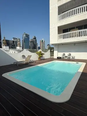 a swimming pool on the roof of a building at Peaceful Cozy Apt with Stunning View&Full Kitchen in Bangkok