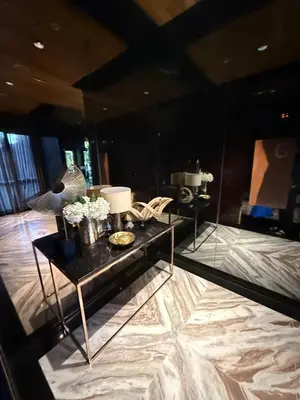 a room with a table with flowers on it at City Heaven - Coowork - Gym - BTS - Pool - Mall - Starbucks - ShoppingMall in Bangkok