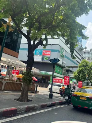 a city street with cars parked in front of a building at CozyroomSukumvit13walktoBTS,MRT in Bangkok