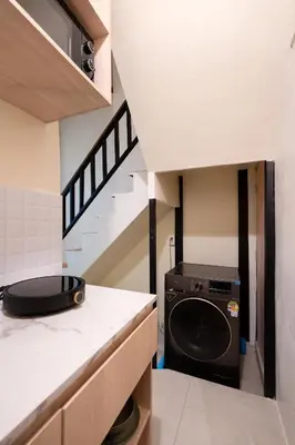 a laundry room with a washer and dryer in a kitchen at OH Homes - Samsen 10 in Bangkok