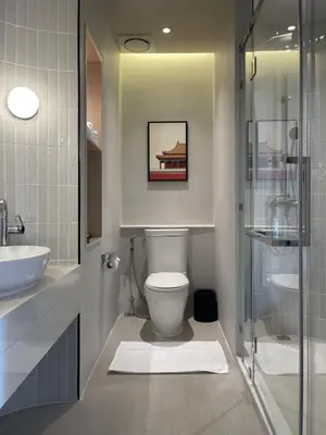 a bathroom with a toilet and a sink and a shower at Chinatown Heritage, Chinatown Main road in Samphanthawong