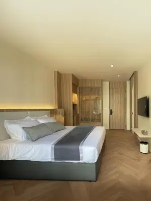 a bedroom with a large bed and a television at Chinatown Heritage, Chinatown Main road in Samphanthawong