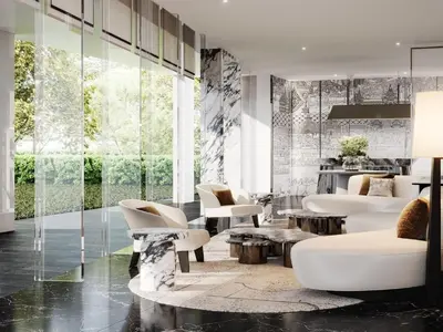 a living room with white furniture and glass walls at La Clef Bangkok by The Crest Collection in Bangkok