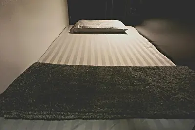 a large bed in a room with at Silom Soi 3 Hash Hostel in Bangkok