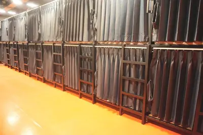 a row of curtains lined up in a row at Silom Soi 3 Hash Hostel in Bangkok