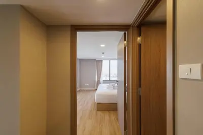a room with a bed and a bedroom with a window at loft \u6cf3\u6c60\u516c\u5bd3 \u4e09\u623f\u4e8c\u536b \u514d\u8d39WiFi in Bangkok