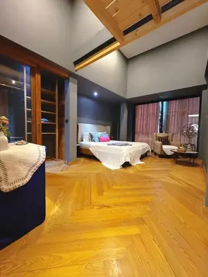 a large room with a bed and a wooden floor at Bangkok Thailand Core Business District 3b3b Duplex Private House Family Room Cooking Smoking Nursery in Bangkok