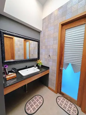 a bathroom with a sink and a mirror at Bangkok Thailand Core Business District 3b3b Duplex Private House Family Room Cooking Smoking Nursery in Bangkok