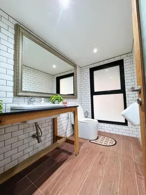 a bathroom with a sink and a mirror at Bangkok Thailand Core Business District 3b3b Duplex Private House Family Room Cooking Smoking Nursery in Bangkok