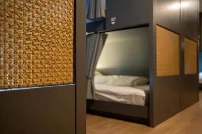 a small bedroom with a bunk bed in a room at The Chedee Krungthep in Bangkok