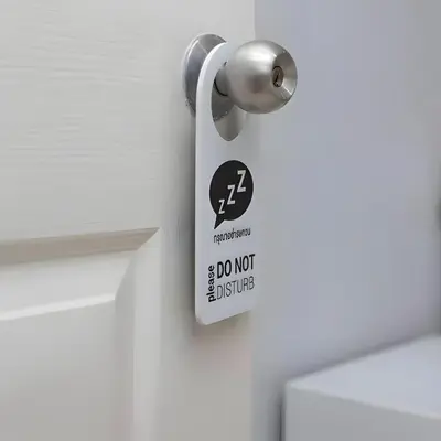 a do not disturb sign on a bathroom door at XX GO INN BTS Nana Sukhumvit Soi 3 x โกอินน์ บีทีเอส นานา ซอย 3 in Makkasan