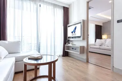 a living room with a couch and a table at Adelphi Forty-Nine in Bangkok