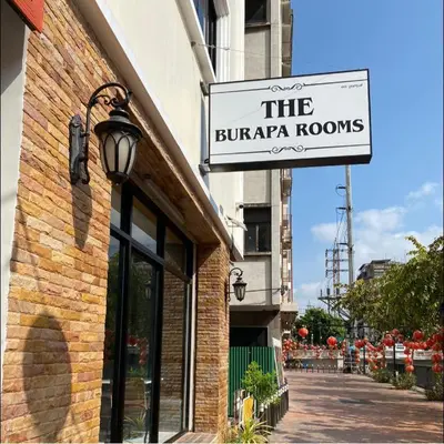 a building with a sign for the burrapapa rooms at The Burapa Rooms in Bangkok