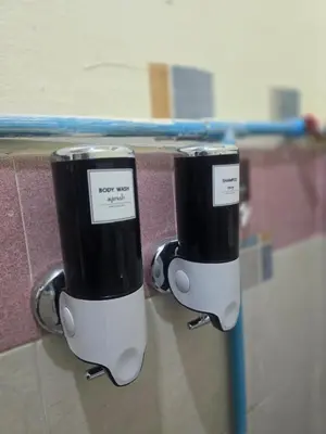 two black and white cups are attached to a wall at 209 Beautiful and Cozy apartment near skytrain & WiFi in Bangkok
