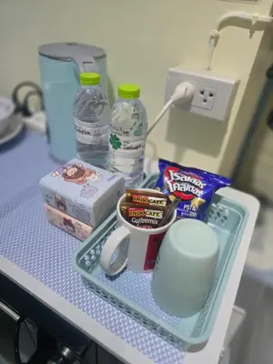a shelf with food and drinks on a table at 209 Beautiful and Cozy apartment near skytrain & WiFi in Bangkok