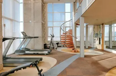 a gym with several exercise equipment in a building at 2Br, Good view, BTS Chitlom, BKK in Bangkok