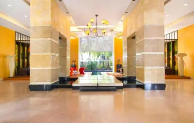 a lobby with columns and a chandelier in a building at 2Br, Good view, BTS Chitlom, BKK in Bangkok
