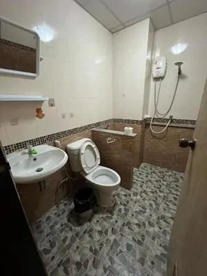 a bathroom with a toilet and a sink at xx GO INN The Giant Swing เสาชิงช้า กรุงเทพ in Bangkok