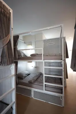 a room with an open closet with some shelves at Risa Hostel - Female Only for Solo Travelers in Bangkok