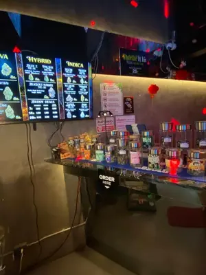a counter in a fast food restaurant with signs on the wall at Mrchow Nana in Bang Kapi