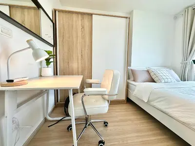 a bedroom with a desk and a bed and a desk and chair at Cosy & Bright 1 bedroom in Bangkok