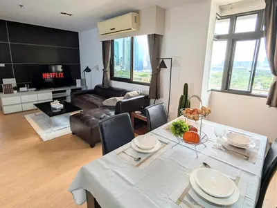 a living room with a table and a couch at High Floor Great View 2BR 2BA 3 mins to Nana BTS in Bangkok