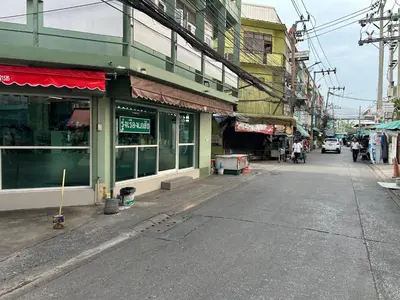 an empty street in a city with buildings at 731 Hostel Victory Monument in Sathani Sam Sen