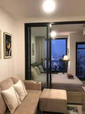 a living room with a couch and a bed at Luxury condo in Bangkok,NearBTSMochit,MRTChatuchak in Bangkok
