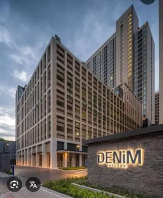 a rendering of a building with a sign on it at Luxury condo in Bangkok,NearBTSMochit,MRTChatuchak in Bangkok