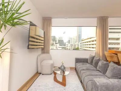 a living room with a couch and a table at 2 Bedrooms for 3 guest comfy home at heart of Silom - 7A in Bangkok