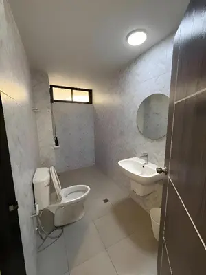 a bathroom with a toilet and a sink at XX Yellow Place Sukhumvit Soi 2 - BTS Nana in Bangkok