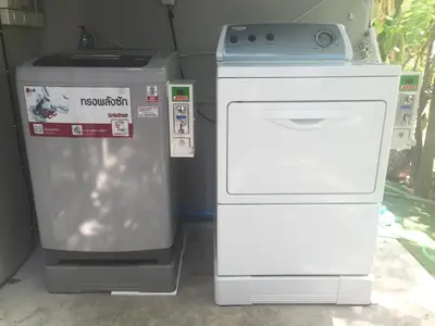 two machines are sitting next to each other at The Cube Hostel Silom in Bangkok
