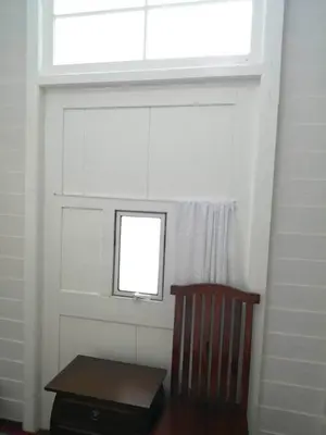 a window in a room with a chair and a table at Baan Chay Klong, Canal side Classic Home 2BRs in Ban Bang Toei (1)
