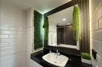 a bathroom with a sink and a mirror at City Center Nana 4-Guest Suite 100m Nana BTS in Bangkok