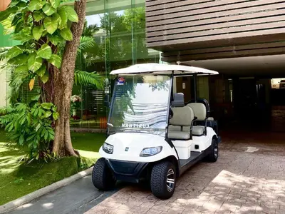 a golf cart parked in front of a house at City Center Nana 4-Guest Suite 100m Nana BTS in Bangkok