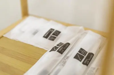 three white napkins sitting on top of a table at A Townhouse 100m from BTS Bangchak in Phra Khanong