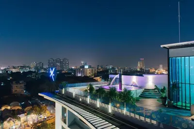a view of a city at night with a building at The Xtreme Suites in Bangkok