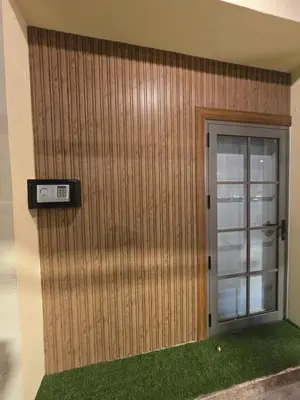 a door with a clock on the side of a building at Victory place 3 in Bangkok