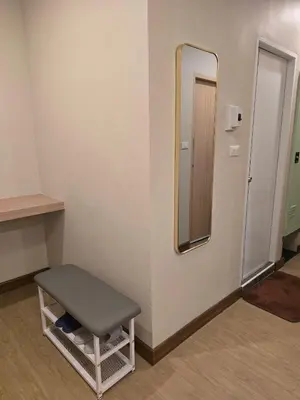 a bathroom with a stool and a mirror at Victory place 3 in Bangkok