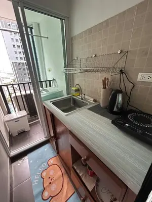 a small kitchen with a sink and a counter top at Perfect 1BR at MRT Bangson by B in Bangkok