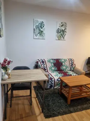 a living room with a couch and a table at Perfect 1BR at MRT Bangson by B in Bangkok