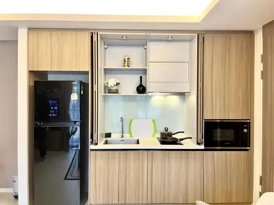a kitchen with a sink and a microwave at Circle 31 #1BR Bangkok in Bangkok