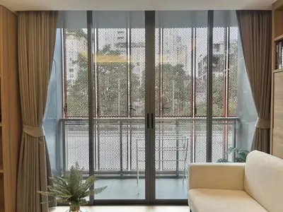 a living room with a large window and a couch at Circle 31 #1BR Bangkok in Bangkok
