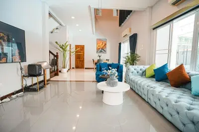 a living room with a couch and a table at 906 Bangkok City Center Single Pool Villa BTS Asok 5 Bedrooms 6 Bathrooms in Bangkok