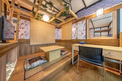 a room with a desk and a chair at SHIN Hotel Victory Monument in Bangkok