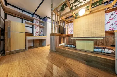 a room with bunk beds and wooden floors at SHIN Hotel Victory Monument in Bangkok