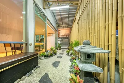 a bird house in the hallway of a building at SHIN Hotel Victory Monument in Bangkok