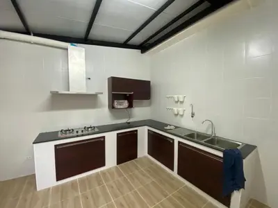 a kitchen with a sink and a counter top at Homey Place 2 in Ban Song Hong