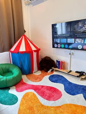 a room with a play tent and a tv at Cozy&Modern 6-BR Home, 14pax - Central, 5mins BTS in Bangkok